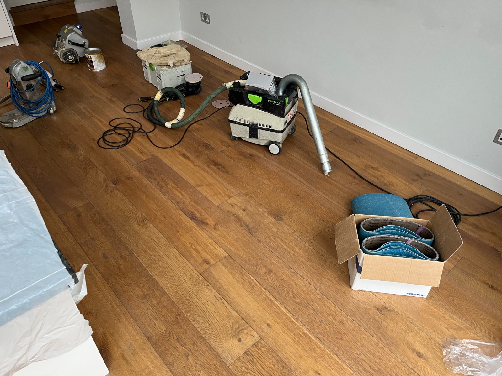 Southwark room with sanding machines and dust extraction set up on an Engineered Oak Plank Floor as Gap Strip Magic prepares to close gaps and refinish.